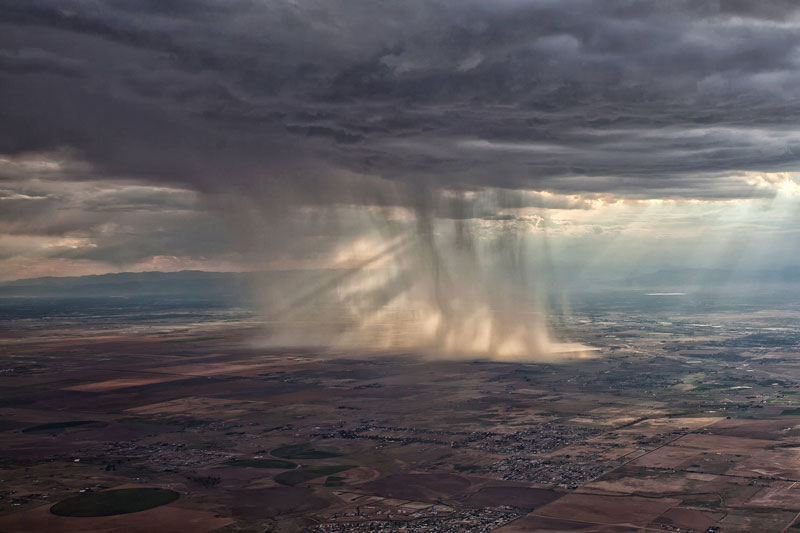 distant-storm-cloud-seen-from-airplane-window.jpg